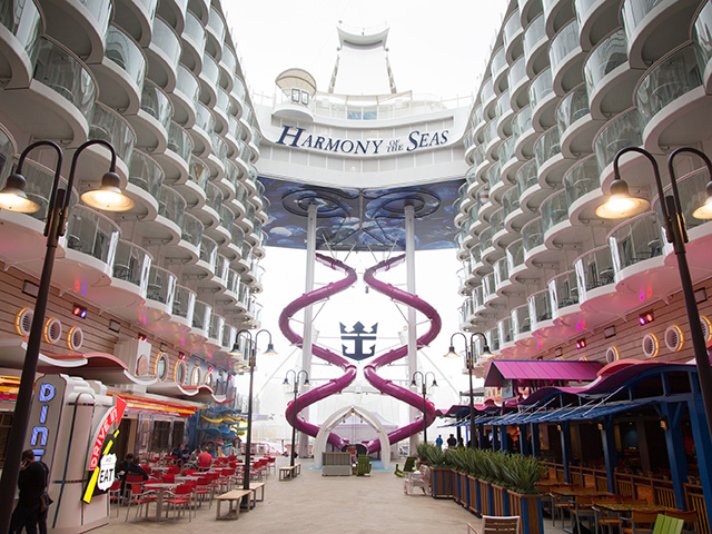 Royal Caribbean International's Harmony of the Seas, the world's largest and newest cruise ship, previews in Southampton, UK. Boardwalk showing The Ultimate Abyss slide.