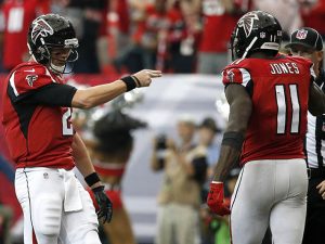 Oct 2, 2016; Atlanta, GA, USA; Atlanta Falcons wide receiver Julio Jones (11) celebrates his touchdown catch with quarterback Matt Ryan (2) in the fourth quarter of their game against the Carolina Panthers at the Georgia Dome. The Falcons won 48-33. Mandatory Credit: Jason Getz-USA TODAY Sports