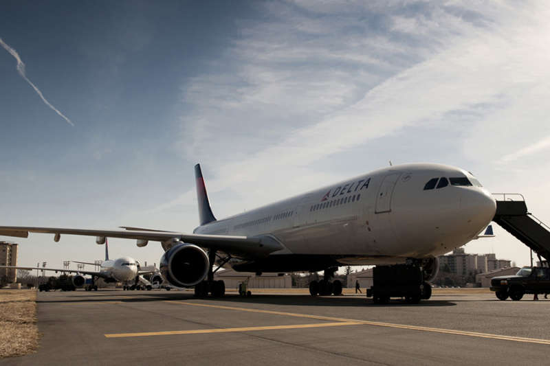 U.S. Air Force Airmen prepare two Delta Airlines passenger aircraft for boarding at Yokota Air Base, Japan, March 12, 2011. The aircraft were diverted to Yokota from Narita International Airport after an 8.9-magnitude earthquake struck off the eastern coast of Japan. (U.S. Air Force photo by Staff Sgt. Samuel Morse)